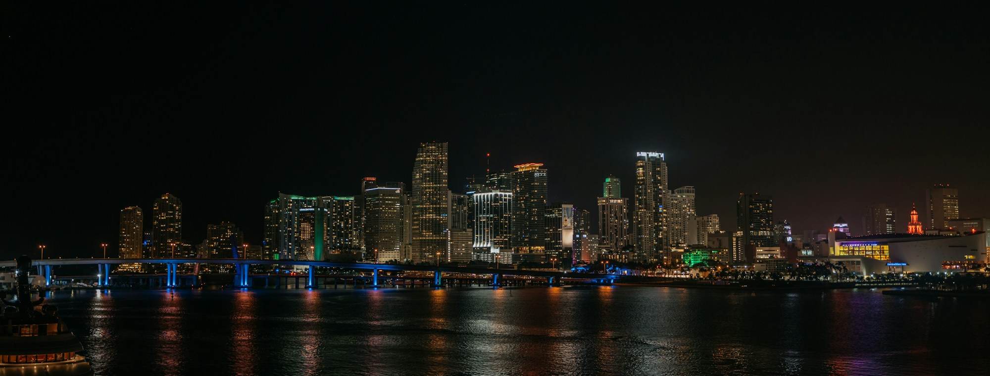 Downtown Miami and Brickell skyline over Biscayne Bay at night