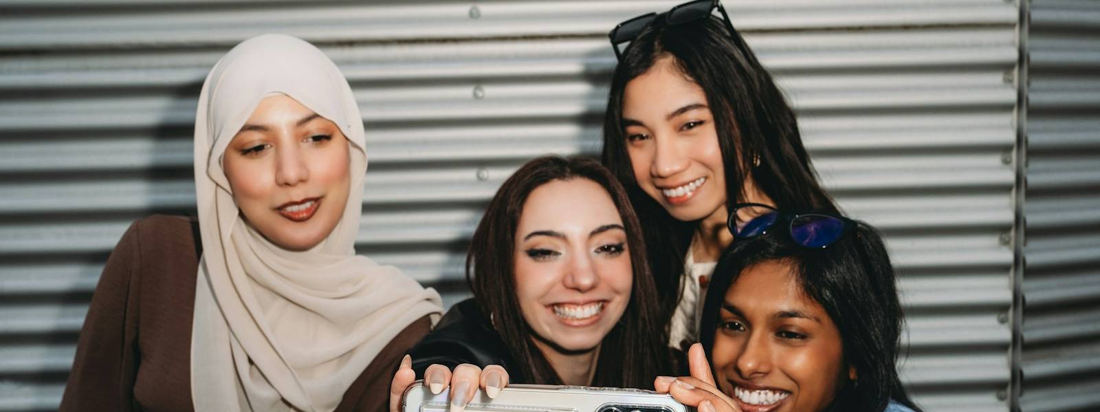 Group of young friends taking a selfie for social media